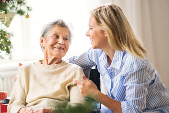 caregiver coversing to her patient